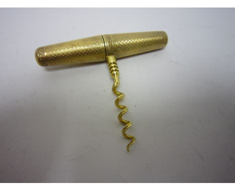 "A George V silver-gilt cased Corkscrew with engine turned decoration and engraved leafage frieze, London 1913, maker: Goldsm