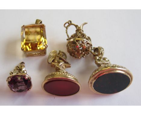 "A Fob set carnelian with cupid finial, an embossed Fob set bloodstone, a pierced Fob set purple stone, a Citrine Pendant cor