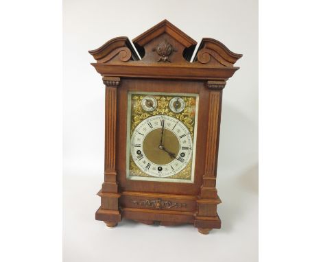 "A late 19th Century walnut cased Bracket Clock with brass dial and silvered chapter ring, three train striking and chiming m