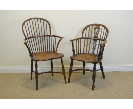 "Two elm and ash Windsor Elbow Chairs, one with stick back and other with pierced and shaped central splat, shaped seats, tur