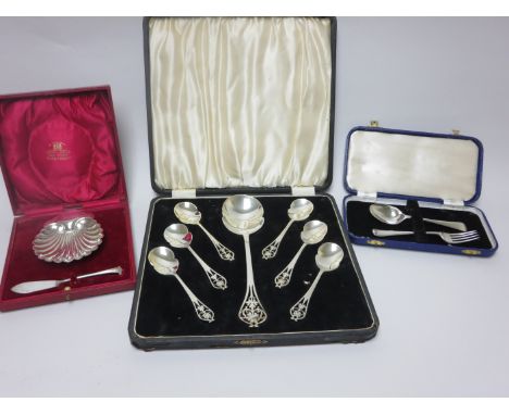 "A George V silver Serving Spoon and six Dessert Spoons with shaped bowls and pierced stems, Sheffield 1937, a George V Butte