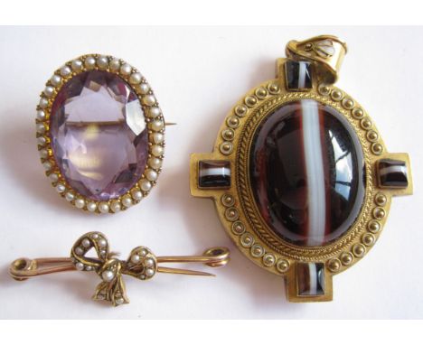 "A Victorian banded Agate Mourning Pendant set large oval cabochon within beaded frame set four smaller stones, an Amethyst a