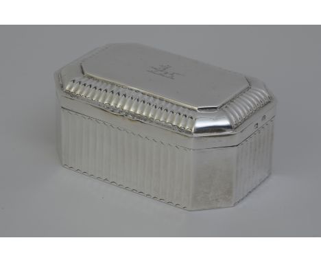 "A George III silver Tobacco Box of oblong form with chamfered corners, engraved crest, inscription inside the lid  From H R 