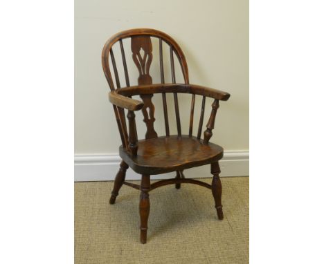 "A 19th Century Child’s Windsor Elbow Chair in yew and elm etc with pierced splat and stick back, solid seat on turned legs w