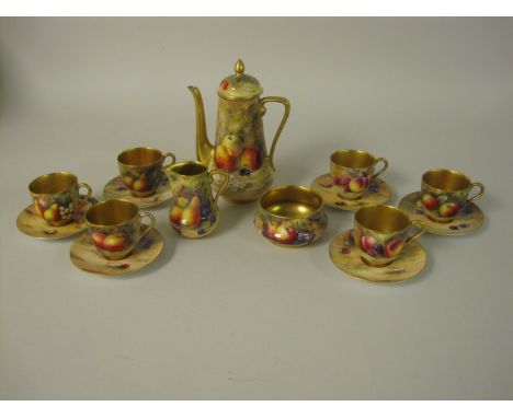 "A Royal Worcester Coffee Service in case, painted fruit and berries, viz: coffee Pot signed Ricketts, Cream Jug signed Shuck