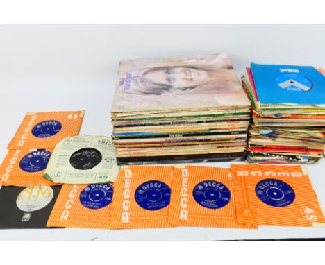 A collection of 12" and 7" vinyl records to include The Carpenters, The Beatles, The Rolling Stones and other. [W]