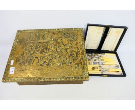 A brass coal box and a silver plated 12 x piece knife and fork cutlery set presented in a black wooden presentation case. Coa
