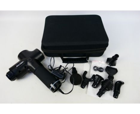 Udream - A Udream massage gun. Comes with seven different type of heads. Massage gun comes with instruction manual and charge