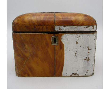 A Regency period tortoiseshell tea caddy, with domed lid lined with red velvet, 13 cm high x 17 cm wide x 9.5 cm deep, a/f 