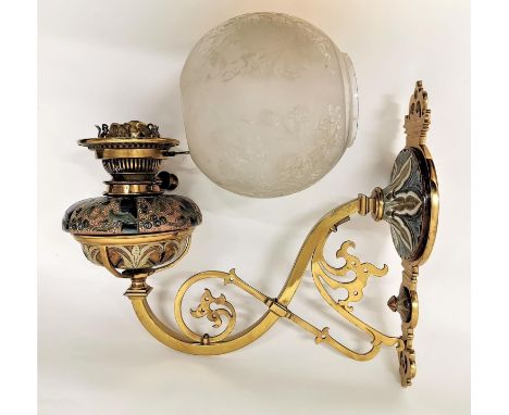 A Victorian Doulton Lambeth stoneware oil lamp wall fitting, in the Arts &amp; Crafts style with brass arm designed with flor