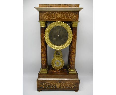 A late 19th century French rosewood portico clock having a silvered dial with Roman numerals and Breguet style hands, the cas