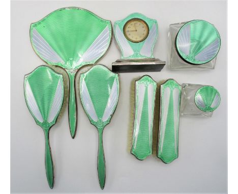 An Art Deco eight piece silver and enamel dressing table set, of which five pieces are by James Dixon &amp; Sons, Birmingham 