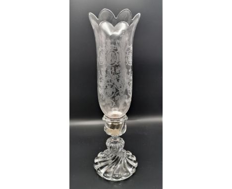A Baccarat hurricane candlestick, the u shaped shade with acid etched acanthus scrolls, on a moulded twisted stem and base wi