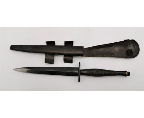 A Fairburn Sykes fighting dagger, 2nd pattern, probably WWII, together with leather scabbard, 29 cm long 