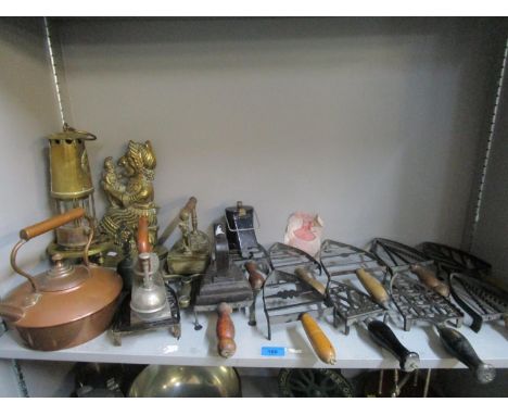 A mixed lot of flat iron trinkets, along with three flat irons, an Eccles brass miner's lamp, a reproduction brass Punch &amp
