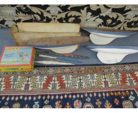 Three vintage pond boats A/F, together with a vintage Jetex Interceptor Fighter model kit A/F 