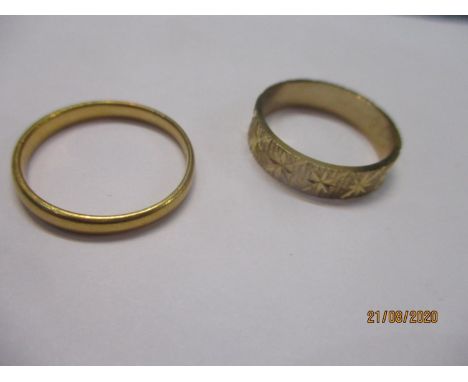 A 22ct gold wedding band 3.50g, together with a 9ct gold wedding band chased 3.58g 