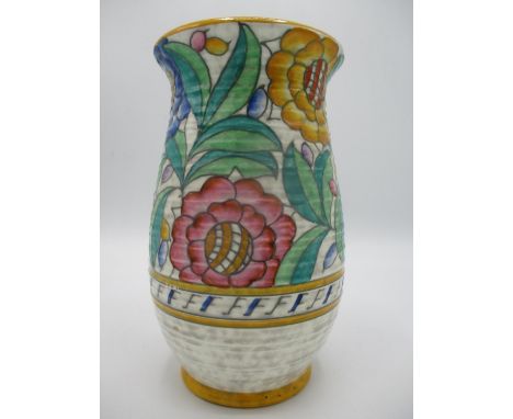 An Art Deco Charlotte Rhead Persian rose ribbed pottery vase circa 1935, painted and tube lined with a brightly enamelled yel