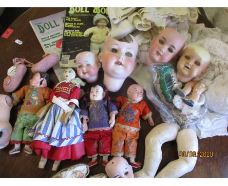 Twentieth Century bisque doll parts, vintage Chinese dolls, miscellaneous dolls clothing and magazines 