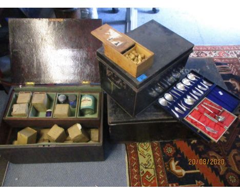 A strong box, together with a twin handled metal box, a treen box containing vintage powder paints and other items 