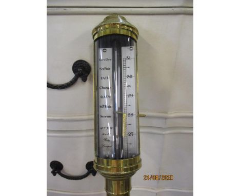 A reproduction brass cases ships barometer inscribed 'Roby Liverpool' 