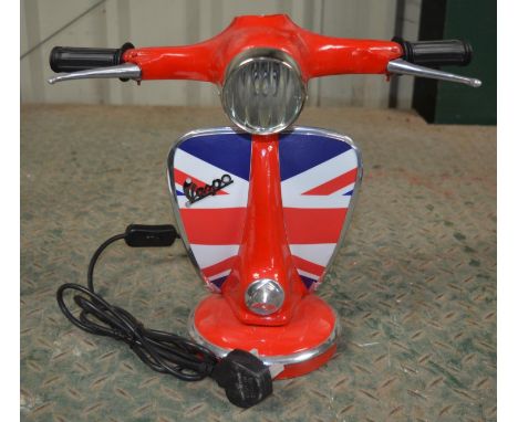 Metal table top light in the form of a Vespa motor scooter front end, tested and in working order. Height approx 33cm 