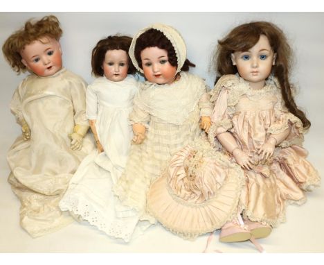 Four bisque head dolls: Heubach Koppelsdorf 320/6,  Heubach Koppelsdorf 50/0, Armand Marseille 990/10, and one marked GP93 