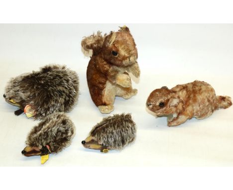 Five mid C20th Steiff animals including three 'Joggi' hedgehogs, a red squirrel and 'Murmy' marmot, max H20cm 