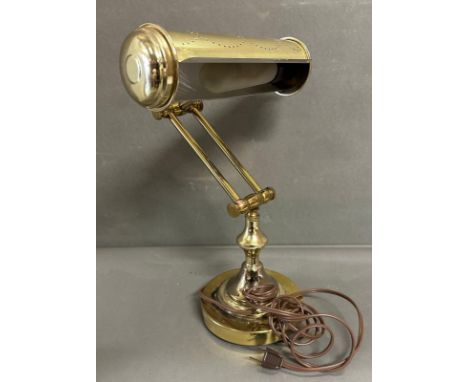 A brass bankers lamp with pierced shade 