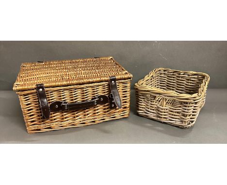 A small wicker hamper and a wicker storage basket 