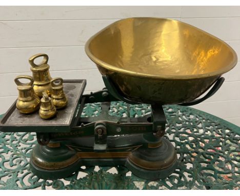 A set of vintage scales with weights 