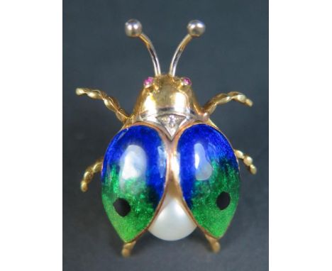 An 18ct Yellow Gold, Enamel, Pearl, Ruby and Diamond Decorated Insect Brooch, 34mm long, 11.1g in Brufords box 