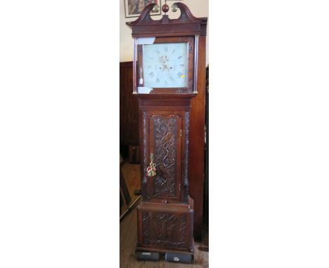 A Victorian Carved Oak Longcase Clock, the eight day striking movement with painted dial, 216cm 