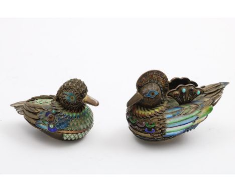 A PAIR OF 20TH CENTURY CHINESE SILVERGILT NOVELTY BOXES in the form of a Mandarin duck and drake, decorated in polychrome clo