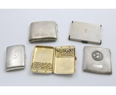 FIVE CIGARETTE CASES:- an art deco example, inscribed inside and initialled "JB" on the cover, another with the badge of the 