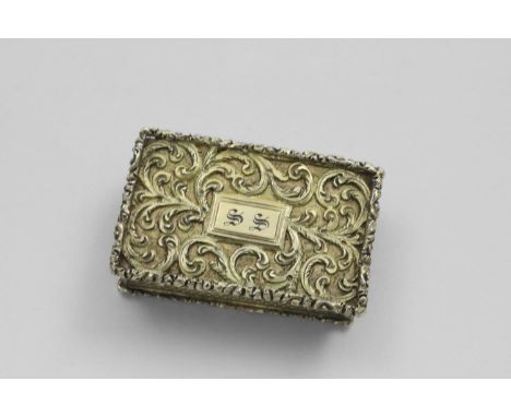 A WILLIAM IV SILVERGILT VINAIGRETTE rectangular with raised borders and engine-turned sides and base, the cover with chased s