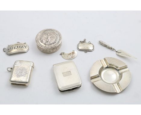 SUNDRY SMALL SILVER:- three various wine labels, a book match holder, initialled, a small circular box, a small circular ash 