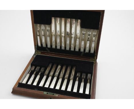 A GEORGE VI CASED SET OF TWELVE PAIRS OF MOTHER OF PEARL-HANDLED FRUIT KNIVES AND FORKS by two makers ("CMA and CJA") Sheffie
