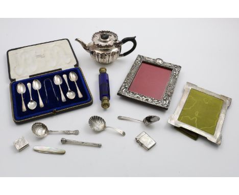 A MIXED LOT:- a late Victorian bachelor's or afternoon teapot. a cased set of 6 teaspoons and a pair of matching sugar tongs,