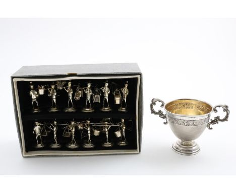 A 20TH CENTURY CHINESE BOXED SET OF TWELVE SMALL COOLIE FIGURES on domed round bases, each one performing their daily routine