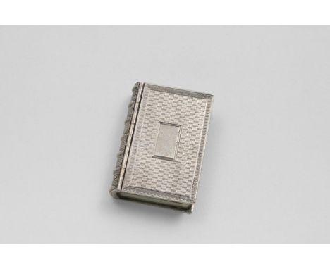 A VICTORIAN ENGINE-TURNED VINAIGRETTE in the form of a book, with vacant cartouche and foliate scroll grille, gilt interior, 