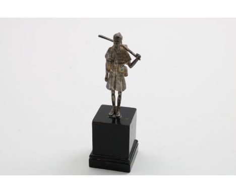 AN ELIZABETH II CAST MILITARY FIGURE holding a rifle over his shoulder, (perhaps a British Indian army soldier), by Carringto