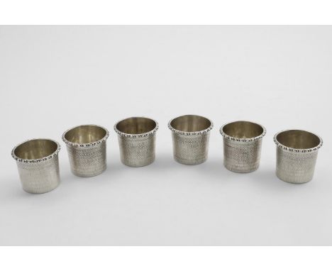 A SET OF 6 VICTORIAN TOT CUPS OR BEAKERS with engine-turned decoration and applied ovolo rims, by Robert Garrard, London 1853