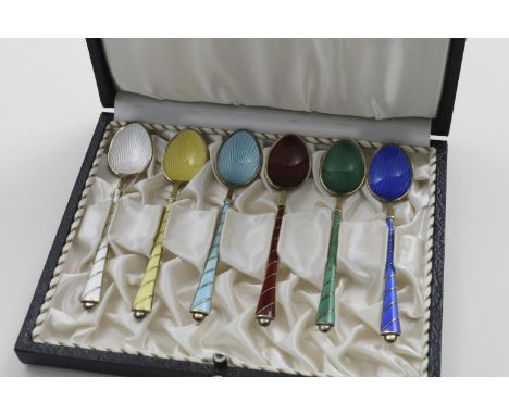 A MID 20TH CENTURY DANISH CASED SET OF SIX SILVERGILT DEMI-TASSE COFFEE SPOONS decorated with coloured enamel, maker's mark o