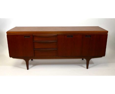 A 1960s teak long sideboard by Greaves &amp; Thomas, having three short drawers, the upper drawer baize-lined for cutlery, si