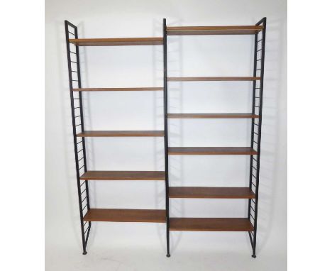 A 1970s Ladderax teak and black painted metal twin open adjustable bookshelf, having eleven shelves and conforming metal conn