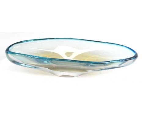 A 1960s Murano heavy art glass table bowl, of elongated oval form, blue and slightly amber tinted, unsigned, length 37.5cmOve
