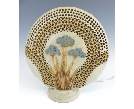 Bernard Rooke (b.1938) - a studio pottery table lamp, raised floral decorated with further reticulated pierced detail, on cir