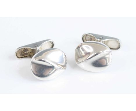 A pair of Georg Jensen silver cufflinks, each of slightly pronounced stylised oval form, with rear hinged mechanism, stamped 