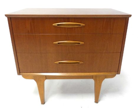 A 1960s Jentique teak compact three-drawer bedroom chest, having pop-up raised superstructure, the graduated drawers with ell